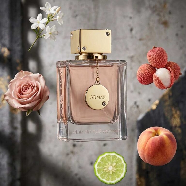 Perfume Club de Nuit Woman de Armaf rodeado de sus notas: rosa, durazno, lichi y jazmín, fragancia femenina