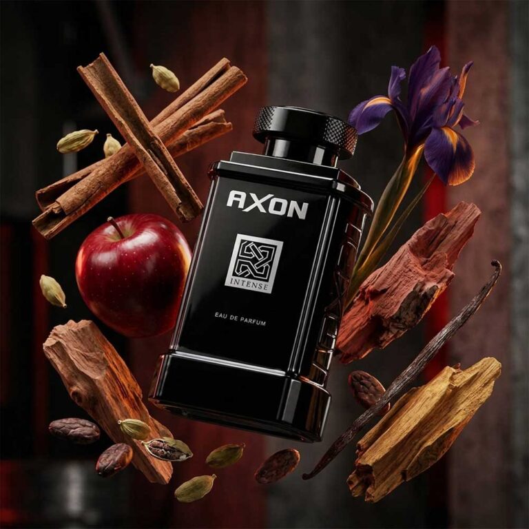 Perfume Axon Intense de Dumont rodeado de sus notas: canela, cardamomo, cacao y manzana, ámbar especiado